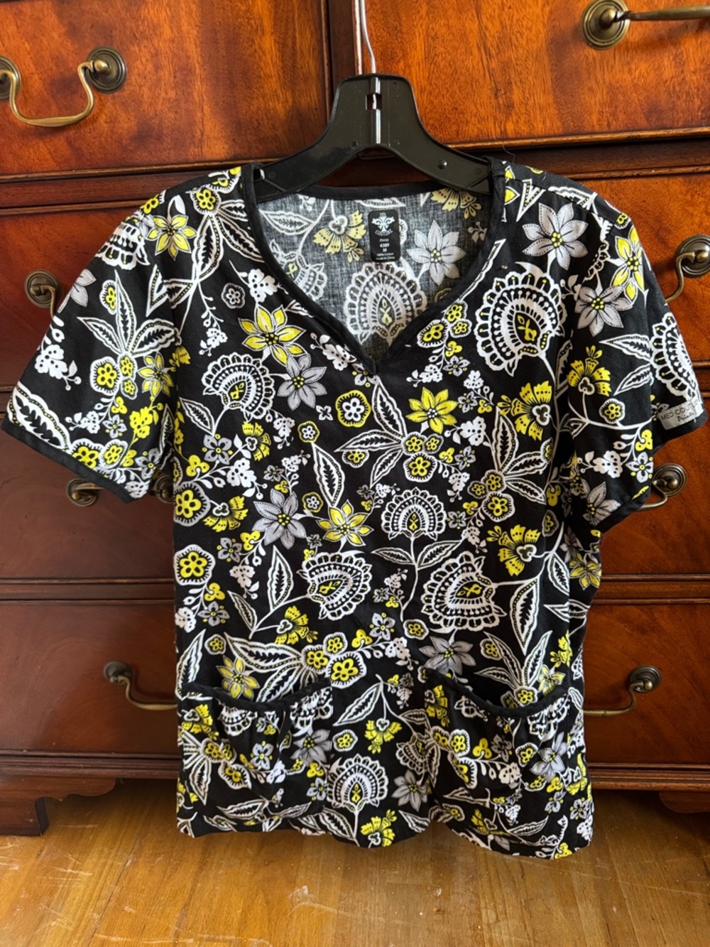 Med Couture women's scrub top a vibrant yellow, white, gray floral and paisley
